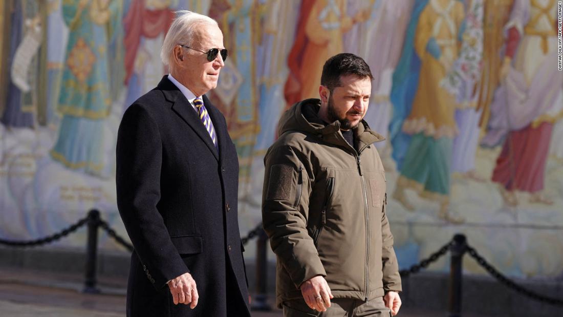Biden walks next to Zelensky after arriving in Kyiv.