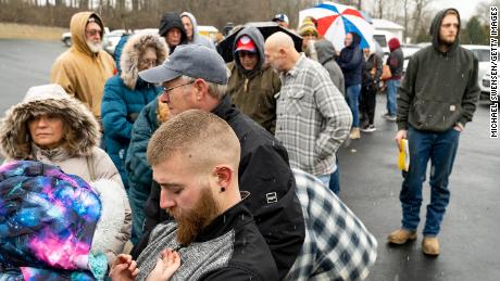 East Palestine residents who had to evacuate wait in line at the Norfolk Southern Assistance Center to collect $1,000 checks and get reimbursed for expenses Friday.