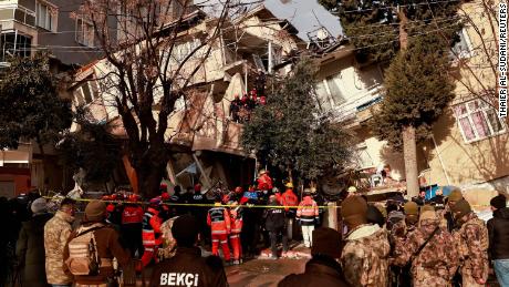 Rescuers, pictured on Tuesday search for victims after a series of aftershocks ripped through Turkey&#39;s southern Hatay province.
