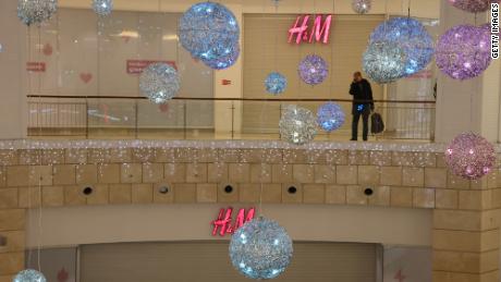A man talks on his phone near a closed H&amp;M store on December 15, 2022 in Moscow, Russia. 