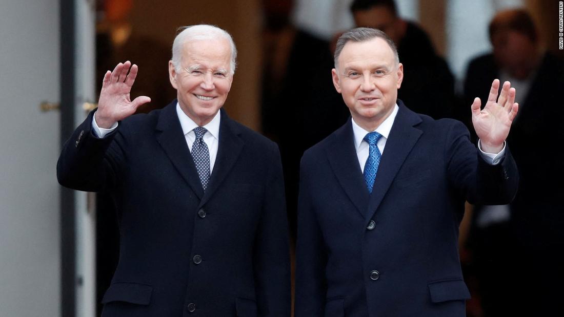 Biden and Polish President Andrzej Duda gesture during a welcome ceremony outside the Presidential Palace in Warsaw, Poland, on Tuesday.