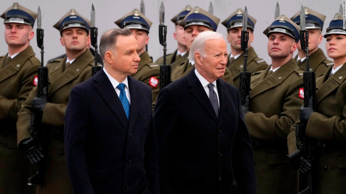 Duda and Biden review a military honor guard at the Presidential Palace in Warsaw.