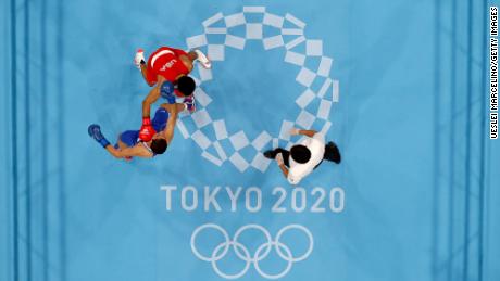 Duke Ragan (red) of Team USA exchanges punches with Albert Batyrgaziev of the Russian Olympic Committee team during the men&#39;s featherwieght final on day thirteen of the Tokyo 2020 Olympic Games at Kokugikan Arena on August 5, 2021.