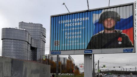 A poster displaying a Russian soldier with the slogan &quot;Glory to the Heroes of Russia&quot; decorates a street near the &quot;PMC Wagner Centre&quot; in Saint Petersburg, Russia, pictured in November 2022.