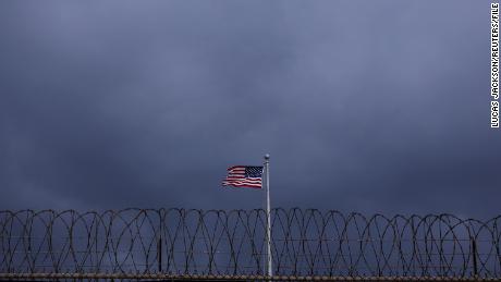 The United States flag flies inside of Joint Task Force Guantanamo Camp VI at the US Naval Base in Guantanamo Bay, Cuba, on March 22, 2016.