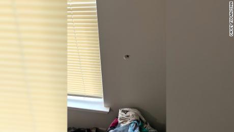 A bullet hole is seen from inside Latasha Smith&#39;s home.