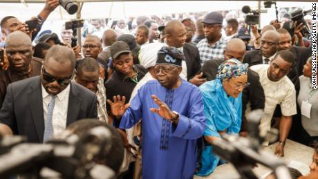 All Progressives Congress (APC) presidential candidate Bola Tinubu and his wife Oluremi Tinubu arrive to vote at a polling station in Lagos on Saturday during Nigeria&#39;s presidential and general election.