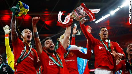 Manchester United&#39;s Raphaël Varane, Bruno Fernandes and Antony celebrating after winning the Carabao Cup final.