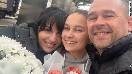 Yeva Hrytsak is surrounded by her parents during her December visit to Dnipro, Ukraine.