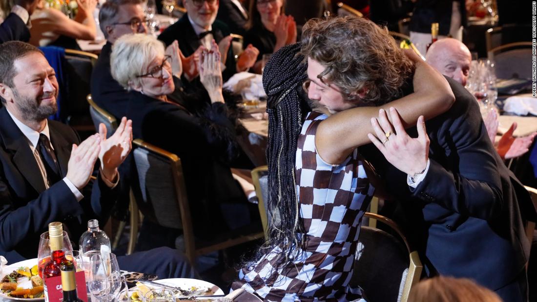 Jeremy Allen White hugs &quot;The Bear&quot; co-star Ayo Edebiri before accepting his award for male actor in a comedy series.