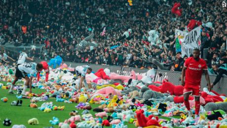 Turkish soccer fans throw stuffed animals on the field, vent dissatisfaction with government quake response 