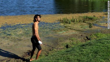 Bhatia again found himself shirtless in the mud at the 15th hole.