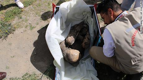 Images of the discovery showed the mummy in a fetal position inside the red delivery bag. 