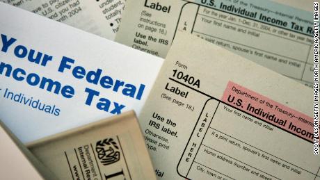 CHICAGO - NOVEMBER 1:  Current federal tax forms are distributed at the offices of the Internal Revenue Service November 1, 2005 in Chicago, Illinois. A presidential panel today recommended a complete overhaul of virtually every tax law for individuals and businesses.  (Photo Illustration by Scott Olson/Getty Images)