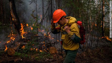 A member of Russia&#39;s Aerial Forest Protection Service pictured during wildfires in July 2021.