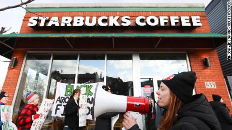 Starbucks workers attend a rally as they go on a one-day strike outside a store in Buffalo, New York, November 17, 2022. 