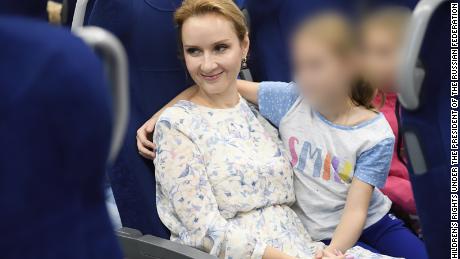 Russia&#39;s Commissioner for Children&#39;s Rights Maria Lvova-Belova pictured with what her office said are orphans from Donbas who have been sent to Russia&#39;s Nizhny Novgorod region. The image was released by Lvova-Belova&#39;s office in September. CNN obscured portions of this image to protect the identity of the children. 