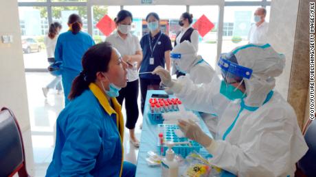 Wuxi residents get tested for Covid in July, 2022. 