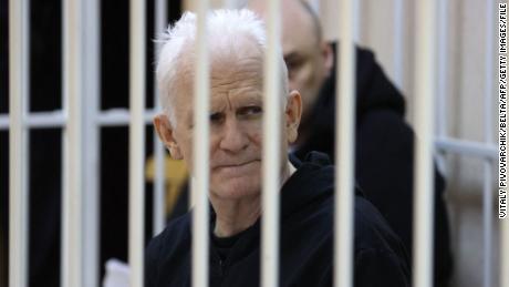 Nobel Prize winner Ales Bialiatski is seen in the defendants&#39; cage in the courtroom at the start of the hearing in Minsk on January 5, 2023. 
