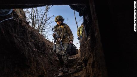 Soldiers from a Ukrainian assault brigade enter a command bunker while waiting for orders to fire a British-made L118 105mm Howitzers on Russian trenches on March 04, 2023 near Bakhmut, Ukraine. Soldiers said they received training on the towed light guns in Germany last summer but took possession of the artillery pieces, sent by the UK, in January, 2023. 