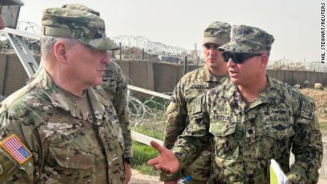 Chairman of the Joint Chiefs of Staff Gen. Mark Milley, left, speaks with US forces at a US military base in northeast Syria during an unannounced visit on March 4, 2023.