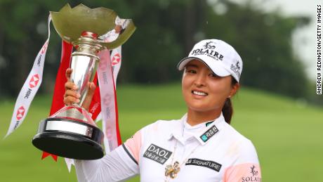 Ko Jin-Young poses with the HSBC Women&#39;s World Championship trophy after victory at Sentosa Golf Club.