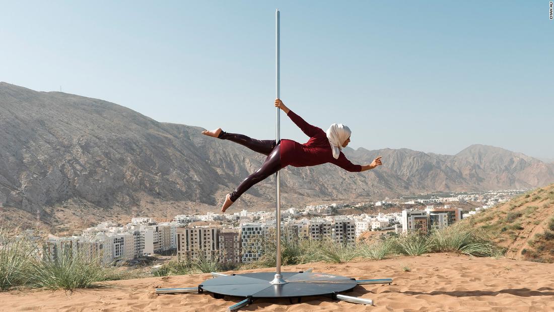 An elegant portrait of a pole dancer in Oman celebrates a woman’s strength in nature