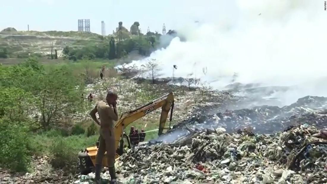 One of India's trash mountains is on fire again and residents are choking on its toxic fumes