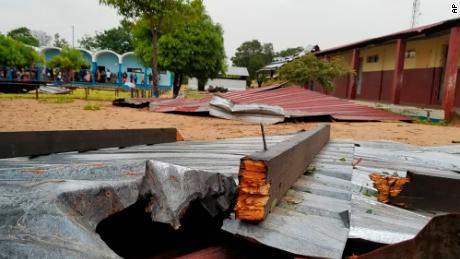 The damaged roof of a school lies in the playground in Vilanculos, Mozambique, on Feb. 24, 2023. The country is bracing for a rare second hit by long-lasting Tropical Cyclone Freddy.