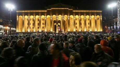 Participants protest against the draft law outside parliament building in Tbilisi on March 8.