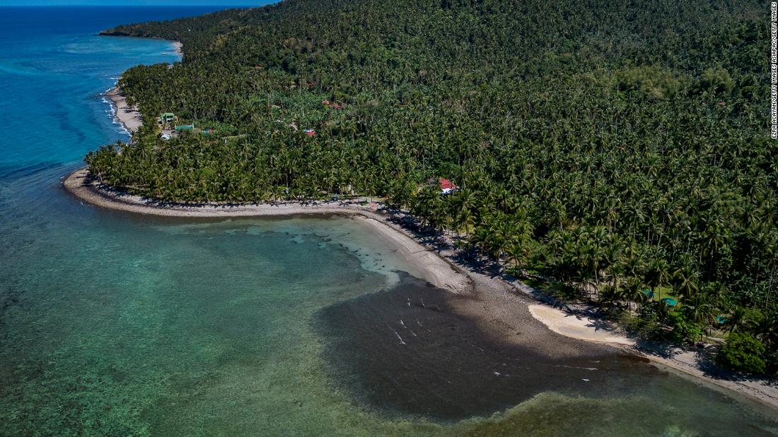 Residents hit by dizziness and fever as oil spill blankets coast of Philippine island