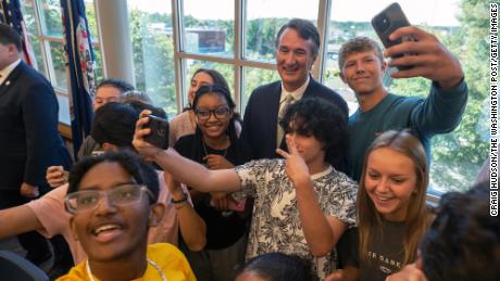 Virginia Gov. Glenn Youngkin takes photos with students after signing an executive order at Colonial Forge High School in Stafford, Virginia, on September 1, 2022.