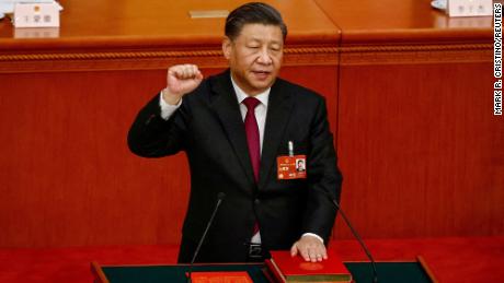Chinese leader Xi Jinping takes his oath while securing a historic third term as president, during a ceremonial vote in Beijing&#39;s Great Hall of the People on Friday.