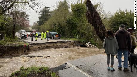 Residents of Soquel, California, are trapped after intense flooding caused the area&#39;s main road to collapse.
