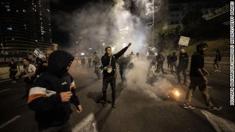 Demonstrators clash with police during protests in Tel Aviv on Saturday.