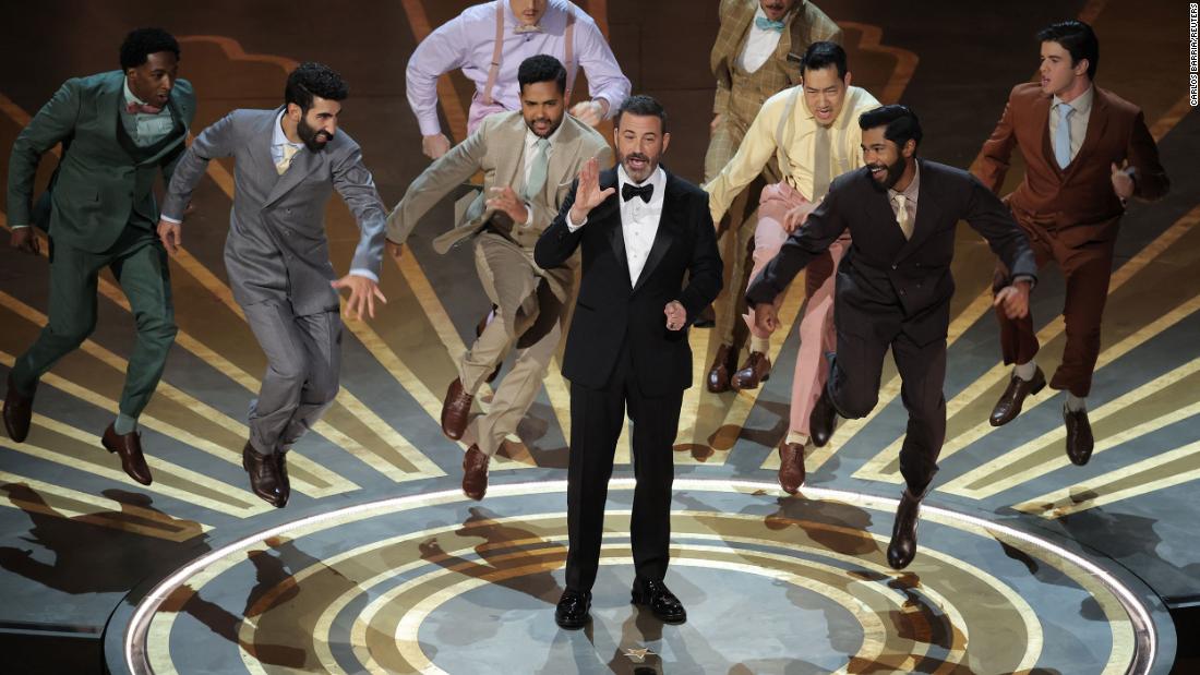 Kimmel gets danced off the stage after his opening monologue.