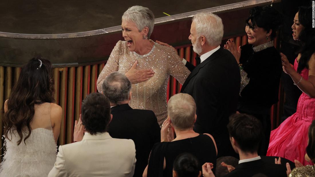 Curtis reacts after winning the Oscar for best supporting actress. &lt;a href=&quot;https://www.cnn.com/entertainment/live-news/oscars-2023/h_e8f449020a786b7353fc0d250e4c3bbb&quot; target=&quot;_blank&quot;&gt;She appeared to be truly surprised&lt;/a&gt; upon hearing her name, yelling &quot;shut up&quot; from her seat when she was announced.