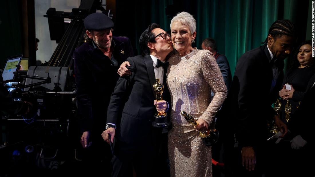 Quan kisses Jamie Lee Curtis backstage. Both won supporting actor Oscars for their roles in &quot;Everything Everywhere All at Once.&quot;