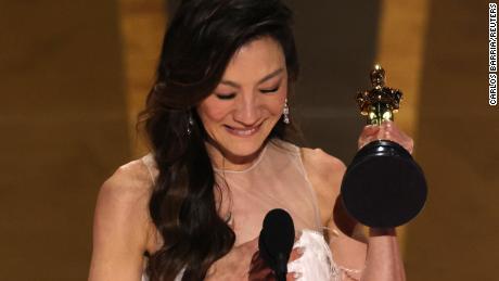 Michelle Yeoh accepts the Oscar for Best Actress for &quot;Everything Everywhere All at Once&quot; during the Oscars show at the 95th Academy Awards.