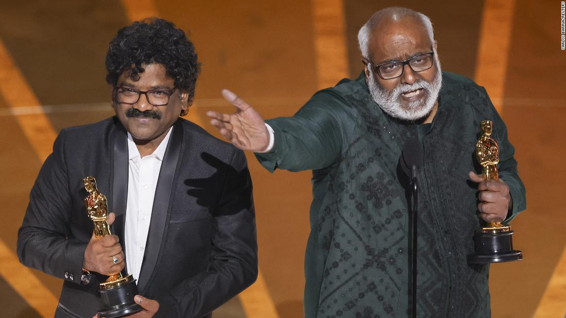 Chandrabose, left, and M.M. Keeravaani accept the Oscar for best original song  (&quot;Naatu Naatu&quot; from the film &quot;RRR&quot;). Keeravaani wrote the music, while Chandrabose wrote the lyrics. &quot;I grew up listening to The Carpenters and now here I am with the Oscars,&quot; Keeravaani said before going on to &lt;a href=&quot;https://www.cnn.com/entertainment/live-news/oscars-2023/h_2452ff1a00c4f0c8ab0149cf89ffbfc8&quot; target=&quot;_blank&quot;&gt;sing his speech&lt;/a&gt; to the tune of &quot;Top of the World&quot; by The Carpenters. &quot;Naatu Naatu&quot; is the first song from an Indian film to be nominated for an Oscar.