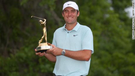 Scottie Scheffler celebrates with The Players Championship trophy after victory at TPC Sawgrass in Ponte Vedra Beach, Florida.