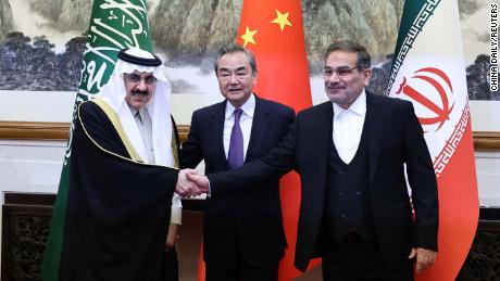 Top Chinese diplomat Wang Yi (middle), Ali Shamkhani, the secretary of Iran&#39;s Supreme National Security Council (right), and Minister of State and national security adviser of Saudi Arabia Musaad bin Mohammed Al Aiban (right) pose for pictures during a meeting in Beijing, China on Friday. 