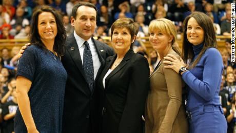 Krzyzewski stands with his family as he is acknowledged for breaking the record for wins in NCAA men&#39;s basketball at Cameron Indoor Stadium on November 18, 2011.