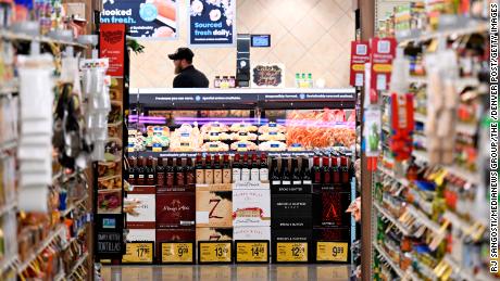  A display of wine is set up in front of the meat and fish department at a Safeway on March 1, 2023, in Aurora, Colorado. Food at home prices have declined in recent months but remain  10.2% higher from last year, according to the February Consumer Price Index.