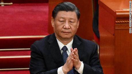 China&#39;s leader Xi Jinping applauds during the fifth plenary session of the National People&#39;s Congress (NPC) at the Great Hall of the People in Beijing on March 12, 2023. 