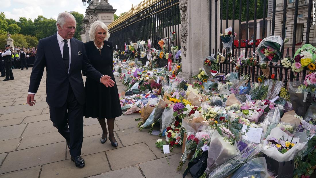 Charles and Camilla view tributes for Queen Elizabeth II that were left outside Buckingham Palace.