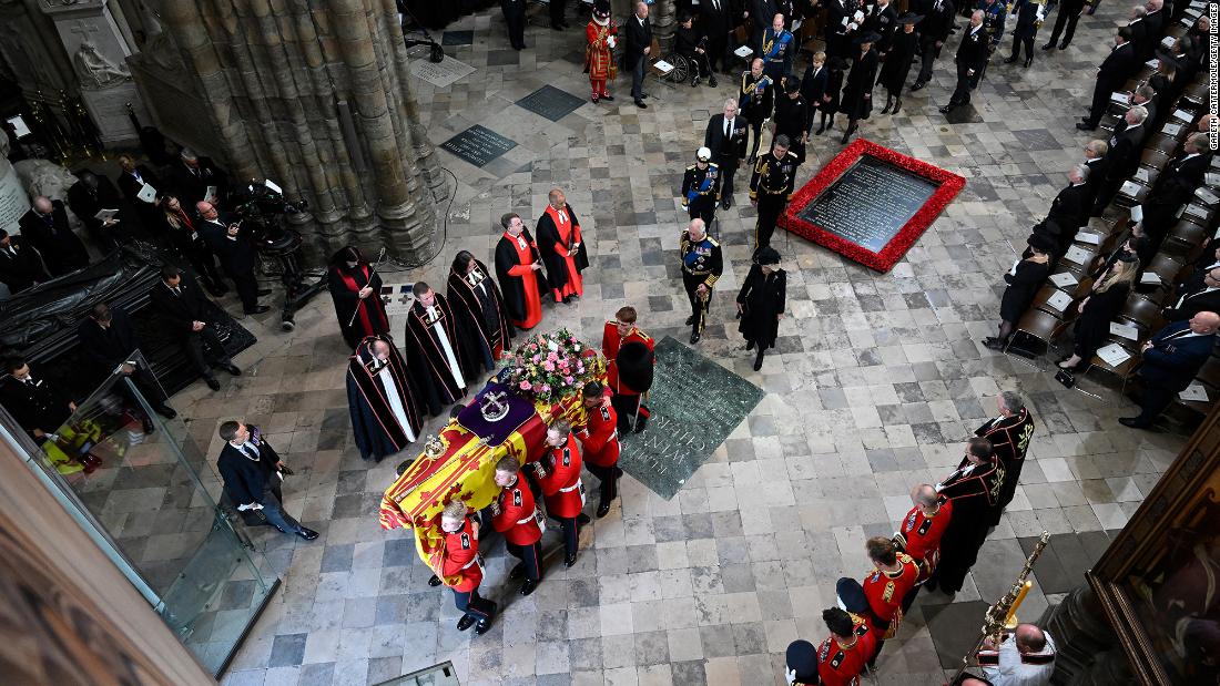 Charles and Camilla walk behind the Queen&#39;s coffin as it is carried out of Westminster Abbey.