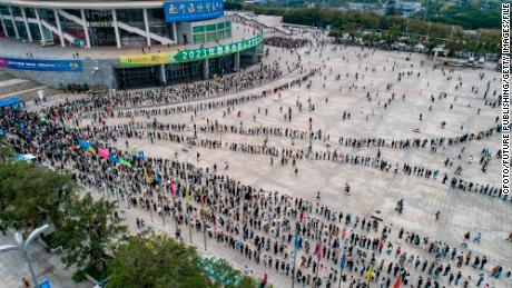 A large number of employment seekers line up outside a job fair in Nanning, Guangxi province on February 18, 2023.