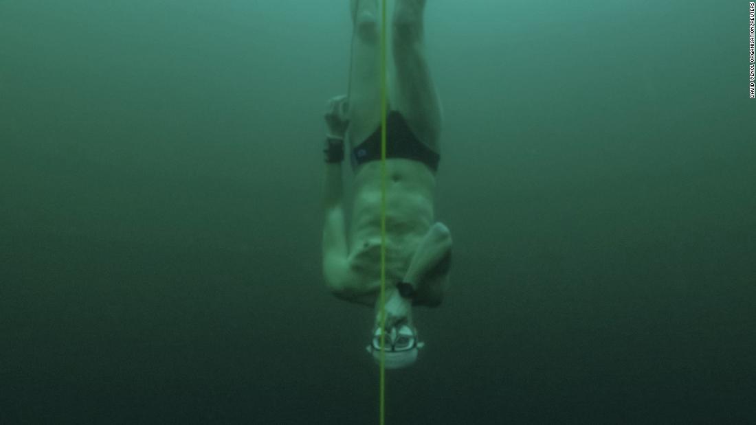 Free-diver plunges to record depth beneath frozen Swiss lake