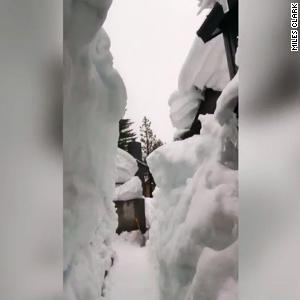 Man builds 12-foot-tall snow tunnel to get out of home